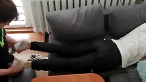 Young beggar pays away his mazuma change with his fingertips